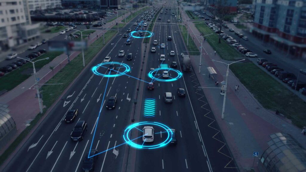 Illustration of vehicles on a road with digital data markers.
